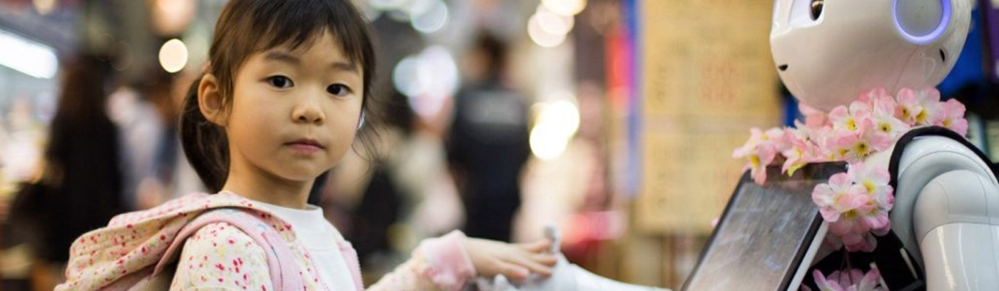 Girl shaking hand with robot